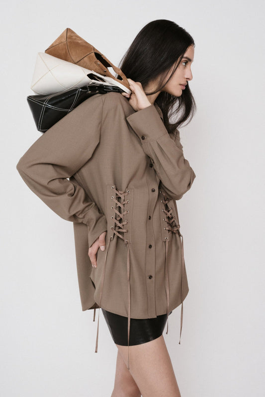 brown lace up shirt three handbags