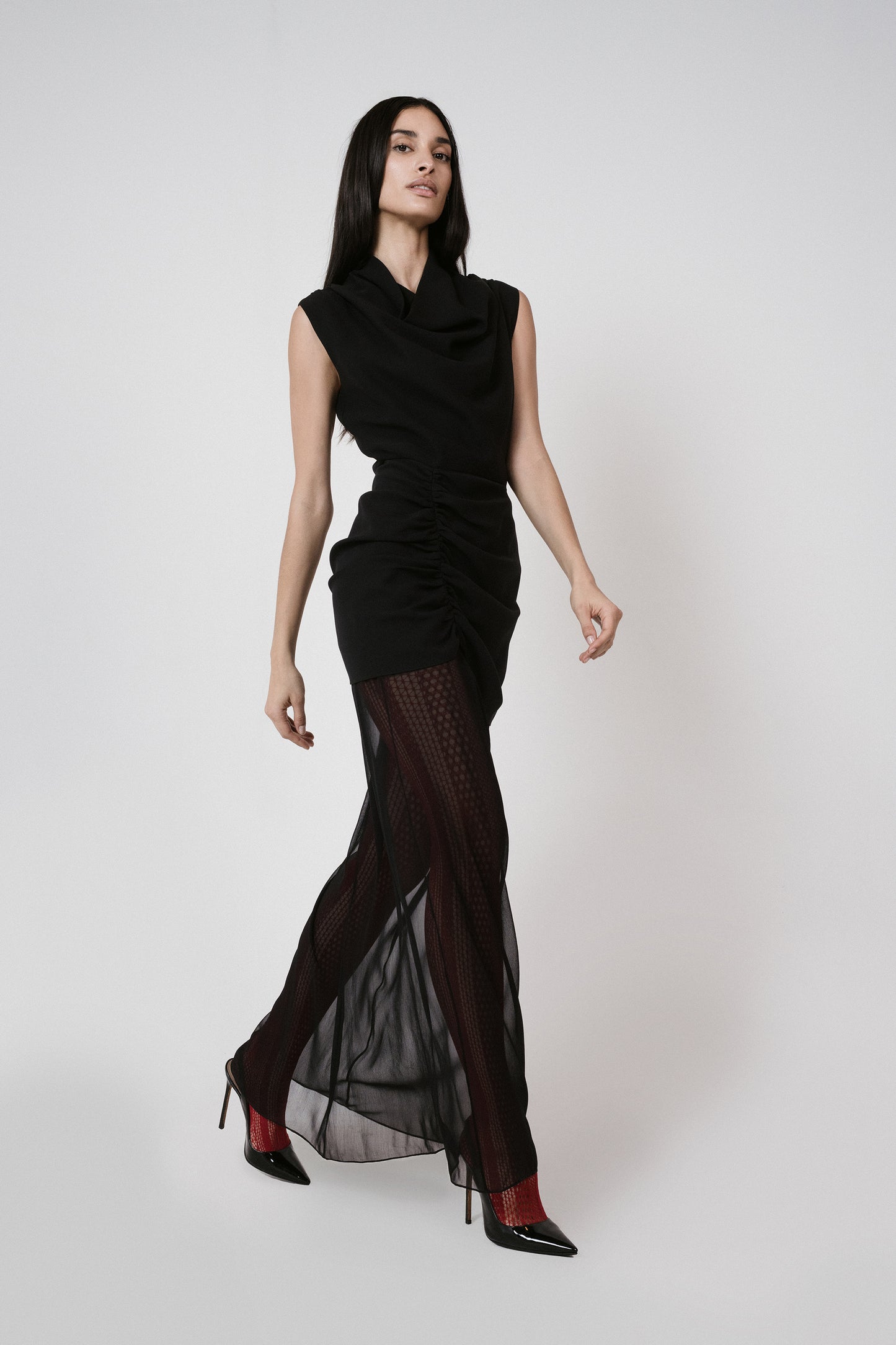 black dress sheer skirt red tights walking
