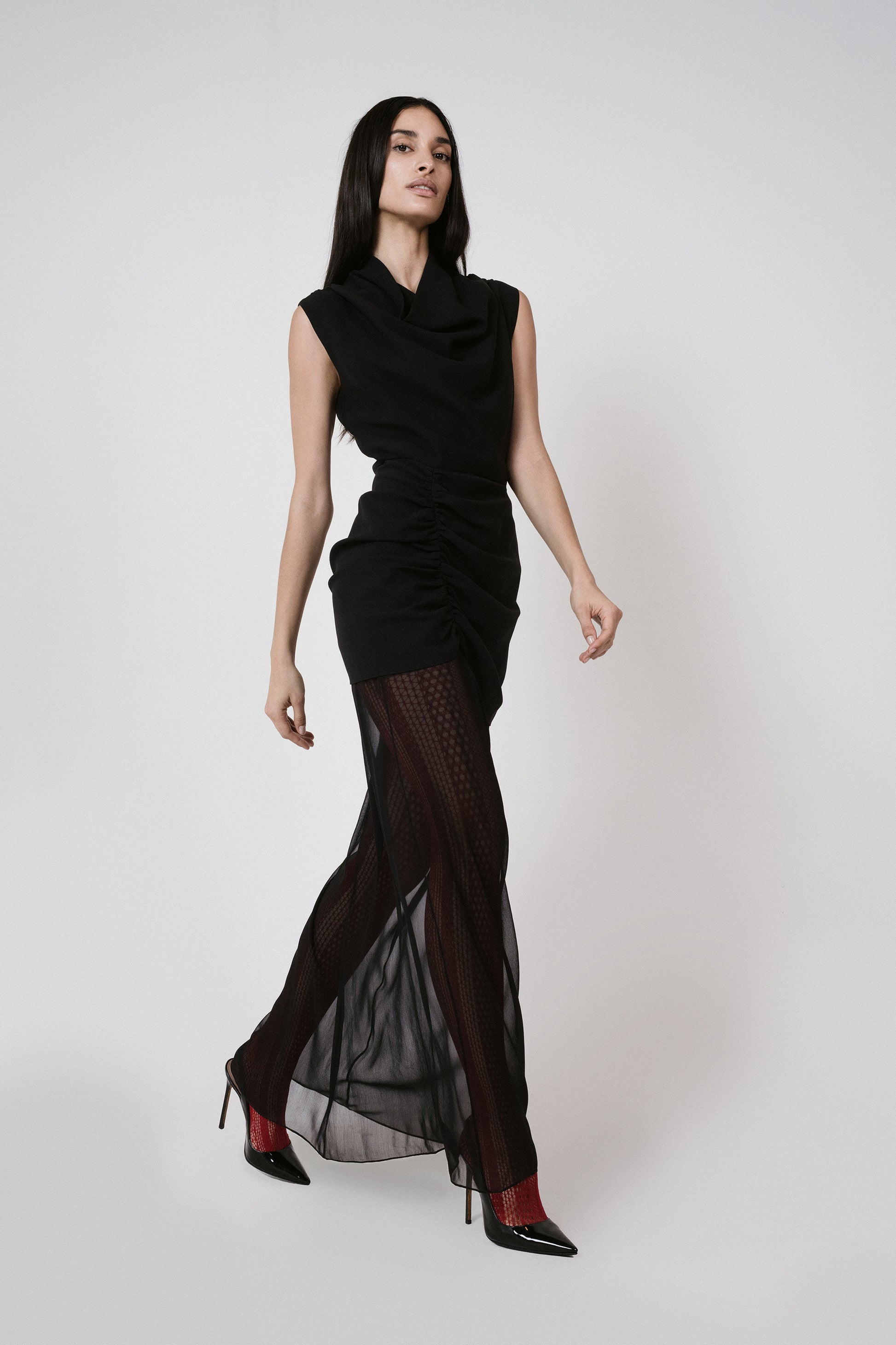 black dress sheer skirt red tights walking