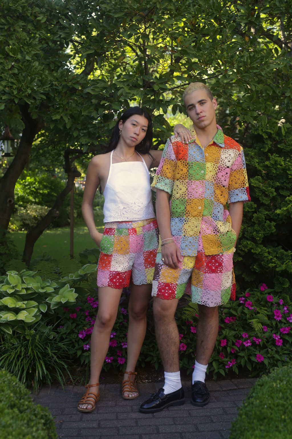 models wearing rainbow crochet clothes
