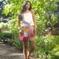 model wears linen top with embroidery