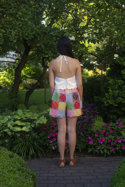 model wears linen top with embroidery