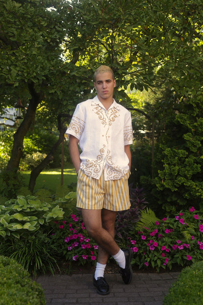 Sam wears the Summer Short in ochre woven stripe
