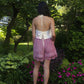 model wears floral embroidered top