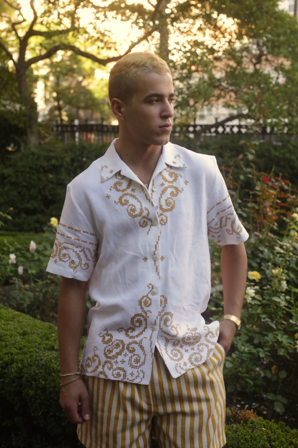 model wears button down shirt with embroidery